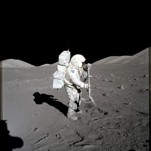 Astronaut Harrison Schmitt collects lunar rake samples during EVA
