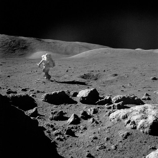 Astronaut Harrison Schmitt retrieving lunar samples during EVA