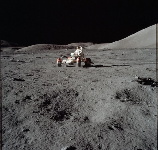 Astronaut Eugene Cernan drives the Lunar Roving Vehicle during first EVA