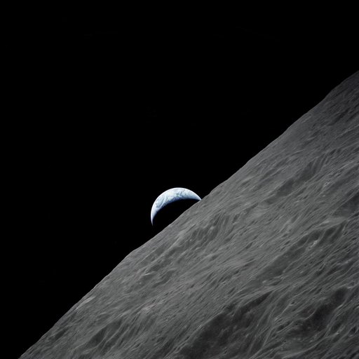 Cresent Earth rises above lunar horizon