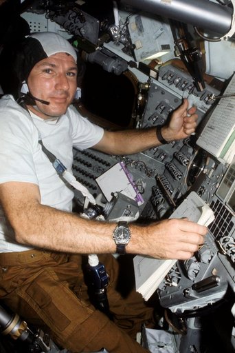 Astronaut Vance Brand at controls of Apollo Command Module