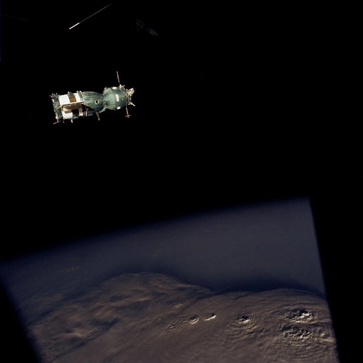 Soviet Soyuz spacecraft contrasted against a black-sky background