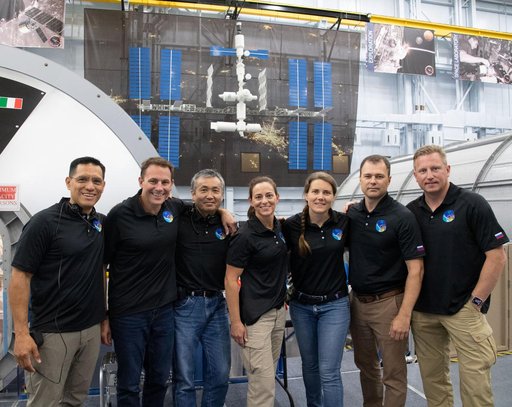 Expedition 68 takes a group photo