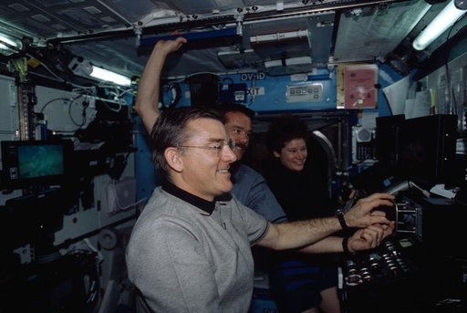 Expedition Two Voss at SSRMS controls with Hadfield and Helms in Destiny module