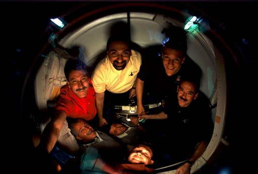 STS-100 crew in docking compartment after docking with ISS