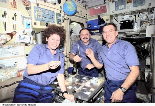 Expedition Two crew eat a meal in the Service Module