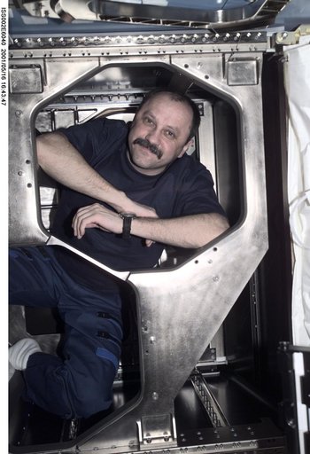 Usachev behind panel in Destiny laboratory