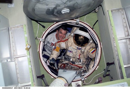 Voss moves Orlan suit in forward hatch of Zvezda module