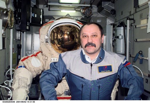 Usachev with Orlan suit in Zvezda Service module