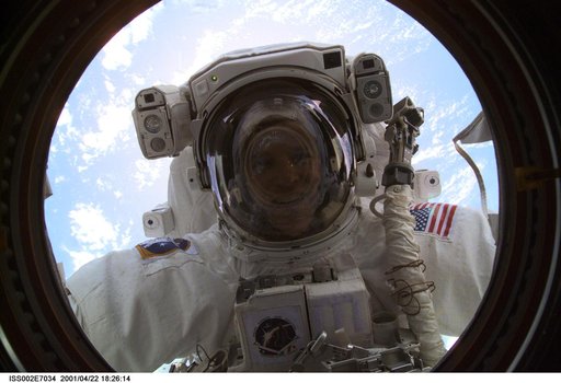 View of STS-100 MS Parazynski during EVA 1 at Destiny laboratory window
