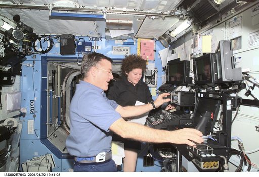Voss and Helms at SSRMS controls in Destiny laboratory module
