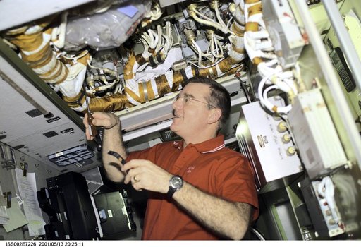 Voss works with cables in panel in the Service Module