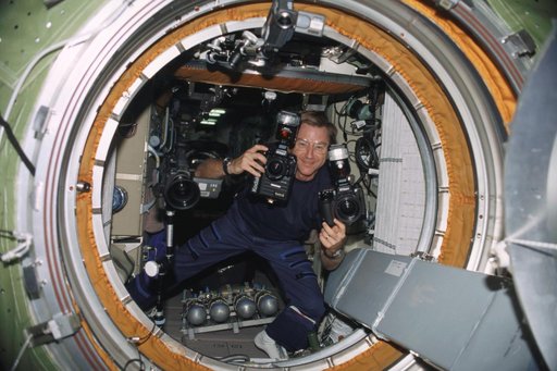 Culbertson photographs the opening of the hatch to the Pirs during Expedition Three