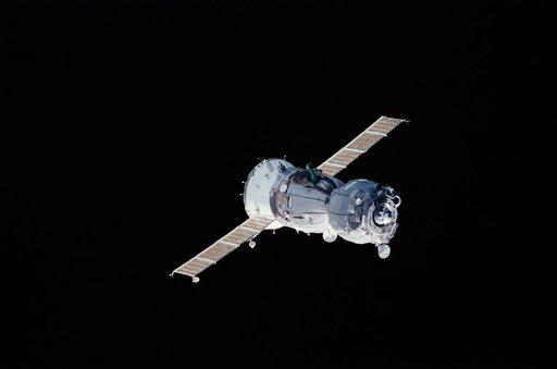 View of a Soyuz spacecraft approaching the ISS during Expedition Three