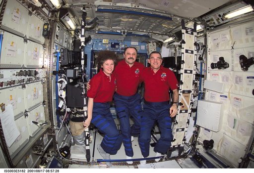 The Expedition Two crew pose in the U.S. Laboratory
