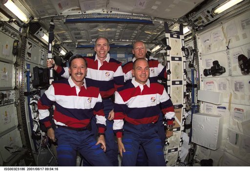 STS-105 crewmembers pose for their group photo in the U.S. Laboratory