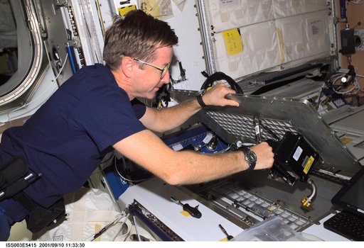 Culbertson performs inflight maintenance in Node 1 during Expedition Three