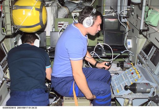 Dezhurov and Tyurin work in Zvezda during Expedition Three