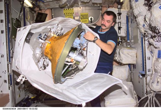 Tyurin packs the docking probe in Node 1 during Expedition Three