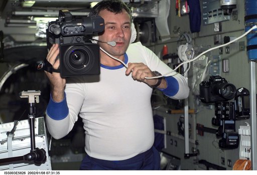 Dezhurov uses a HD camera in Zvezda during Expedition Three