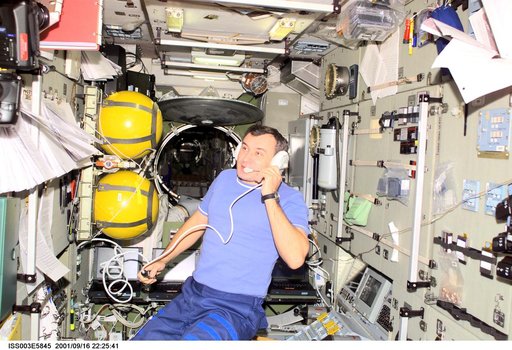 Dezhurov uses communication equipment in the Service Module during Expedition Three