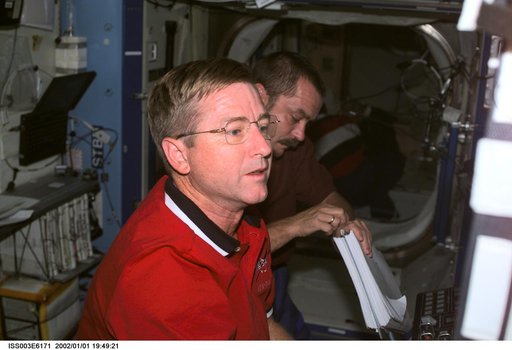 Culbertson and Tyurin work at the SSRMS controls in Destiny during Expedition Three