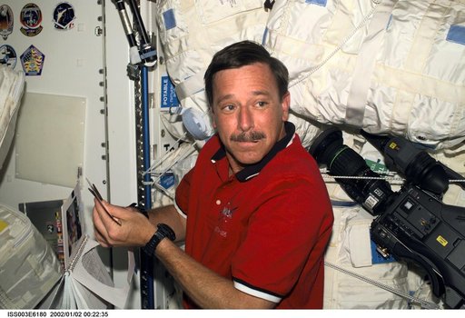 STS-105's Horowitz works on a mission logo in Node 1