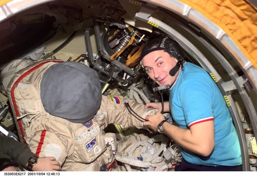 Dezhurov works on an Orlan suit in Pirs during Expedition Three