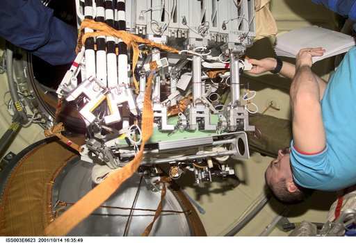 Tyurin readies the NASDA exposure experiment cases for their EVA