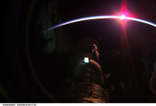 View of the ISS with a sunrise background taken during Expedition Three