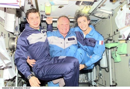 The Soyuz Taxi crew pose for a group photo in Zvezda during Expedition Three