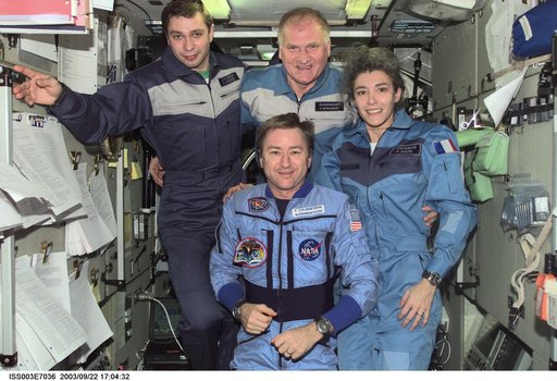 Taxi and Expedition Three crews pose for a group photo in Zvezda during Expedition Three