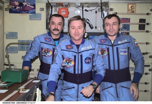 Expedition Three crew pose for a group photo in Zvezda during Expedition Three