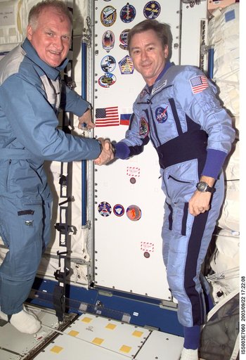 Afanasyev and Culbertson pose in Node 1 during Expedition Three