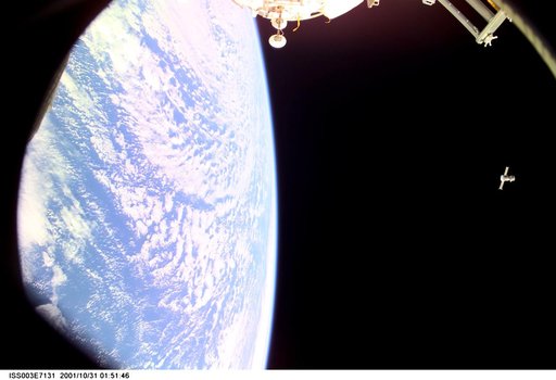 Distant view of the Soyuz carrying the Taxi crew after undocking from the ISS