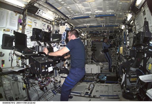 Tyurin works at the SSRMS controls in Destiny during Expedition Three