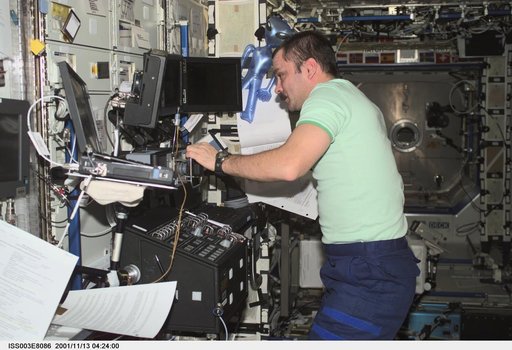Tyurin works at the SSRMS controls in Destiny during Expedition Three