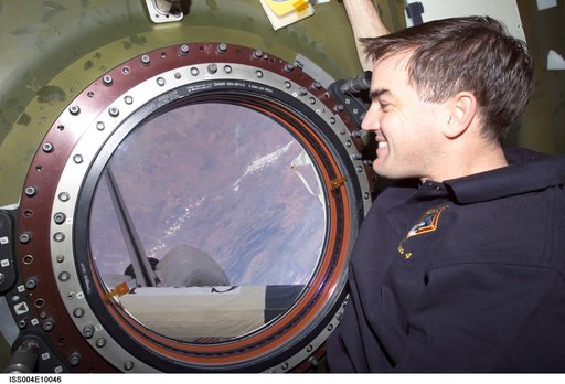 STS-110 MS Walheim at nadir window in U.S. Lab during Expedition Four
