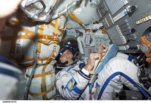 Walz seated in the Soyuz 3 capsule during Expedition Four rescue craft relocation