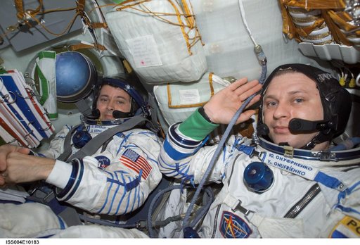 Onufrienko and Bursch seated in the Soyuz 3 capsule during Expedition Four rescue craft relocation