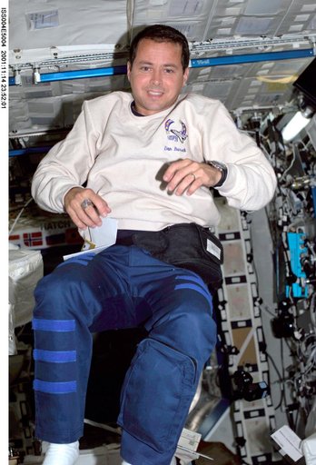 Dan Bursch smiles for the camera in the U.S. Laboratory during Expedition Four.