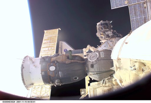 ISS, Soyuz, and Endeavour undocking seen from the SM during Expedition Four