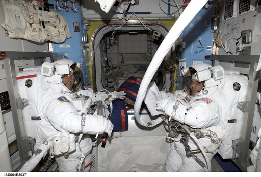 Bursch and Walz prebreathe OPS for EVA 3 in the Quest Airlock, Expedition Four