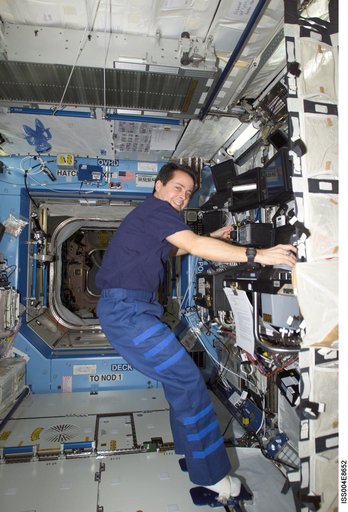 Bursch works with SSRMS controls in the U.S. Laboratory during Expedition Four