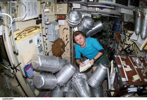 Onufrienko catalogs water containers in the Zvezda SM during Expedition Four