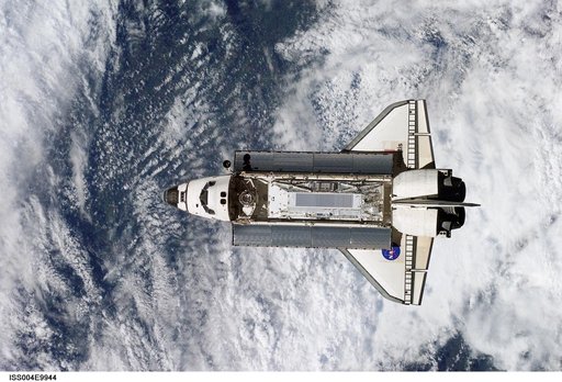 Shuttle Atlantis on approach for docking to the ISS during STS-110 and Expedition Four