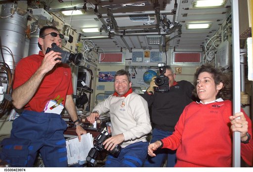 STS-110 crewmembers gather in the Zvezda SM on first day of joint OPS with EXP Four