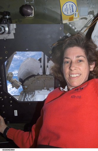 MS Ochoa at U.S. Lab nadir window during STS-110, Expedition Four joint OPS