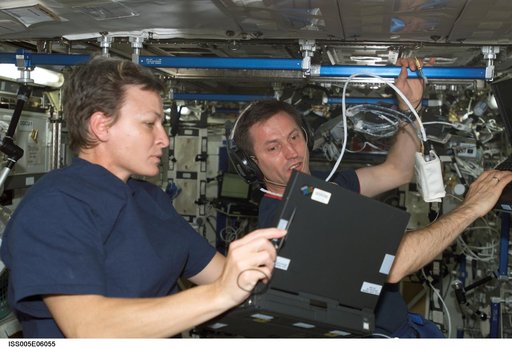 Expedition Five Flight Engineer Whitson and Treschev during on-orbit hearing assessment