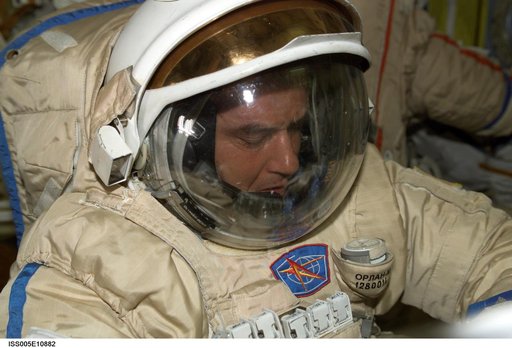 Korzun attired in his Russian EVA Orlan suit prepares for an EVA in the Pirs Docking Compartment